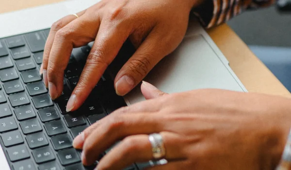 IT professional working at a laptop, evaluating Microsoft Copilot deployment for their organization