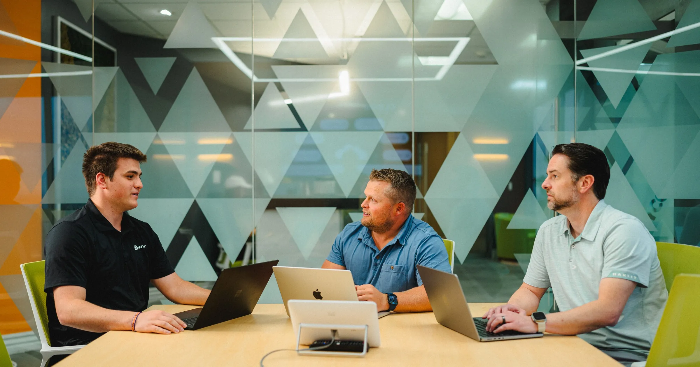 IT leaders discussing Microsoft 365 Copilot strategy around a conference table
